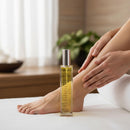 Person applying The Olive Sense body oil with precious oils and vitamin E, fast-absorbing, dry-touch.