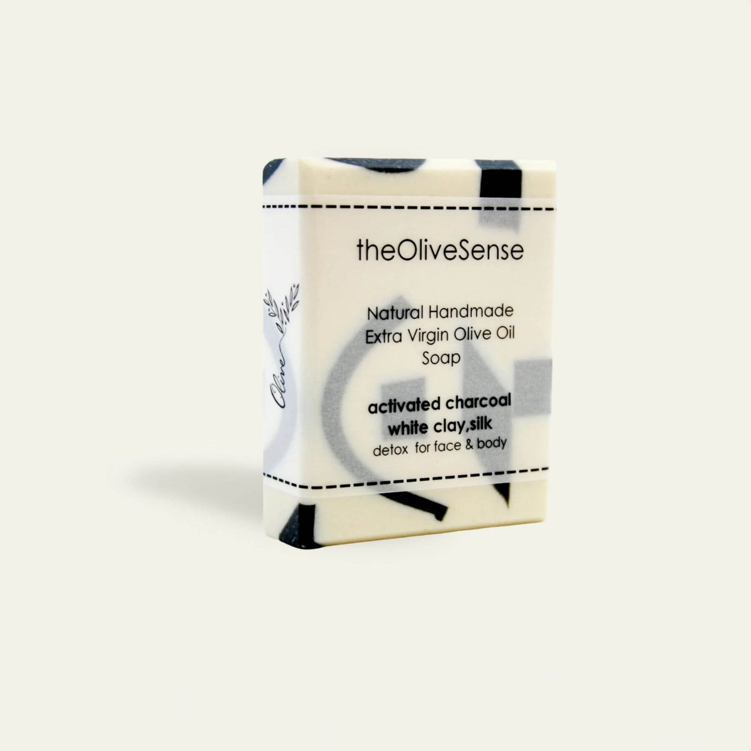 Bar of soap with packaging labeled 'theOliveSense' on a white background