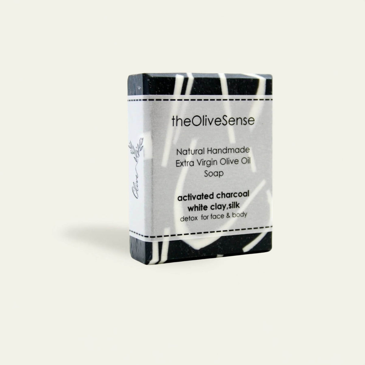 Bar of soap with 'theOliveSense' branding on a white background