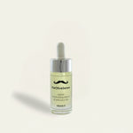 Bottle of 'theOliveSense' beard oil on a light beige background
