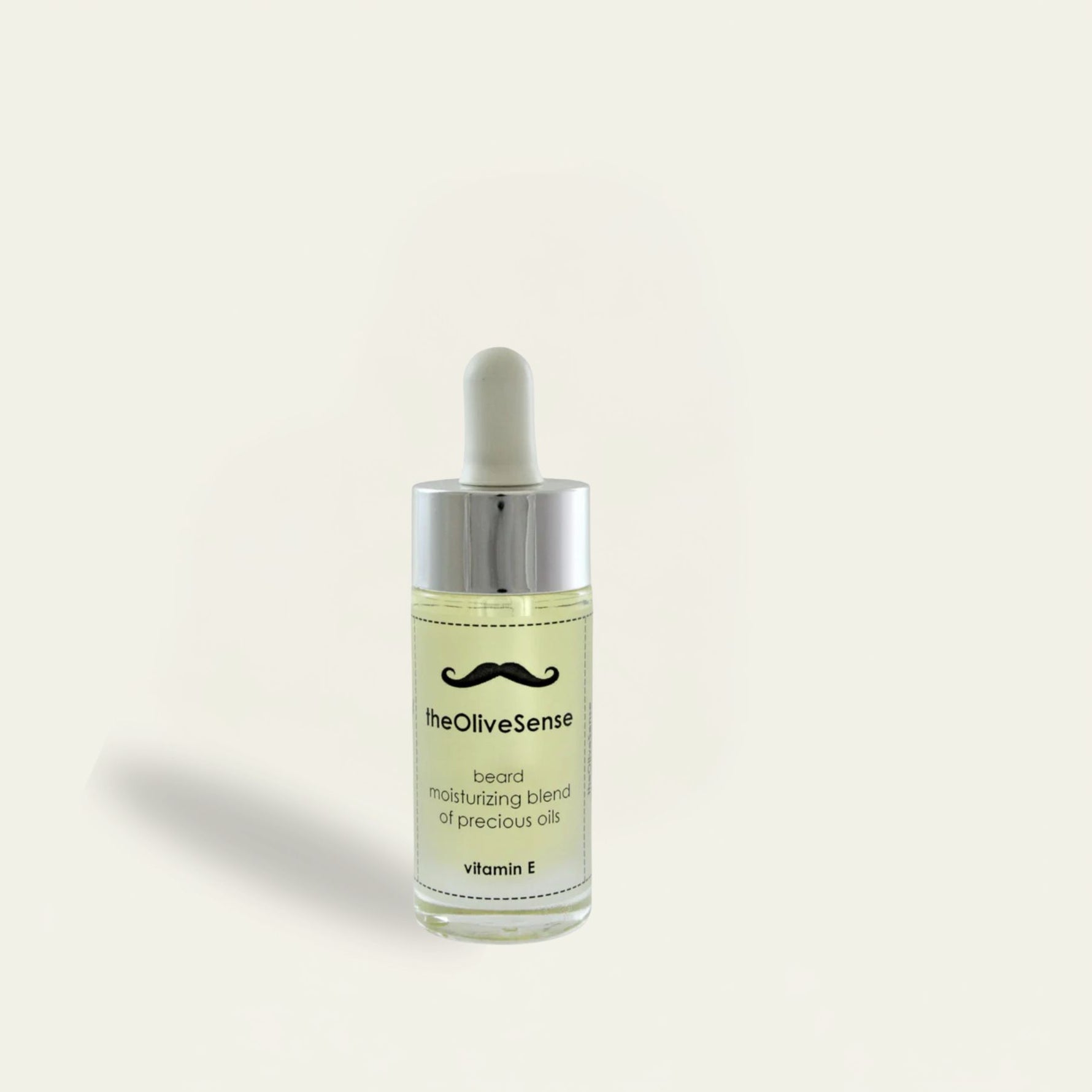 Bottle of 'theOliveSense' beard oil on a light beige background