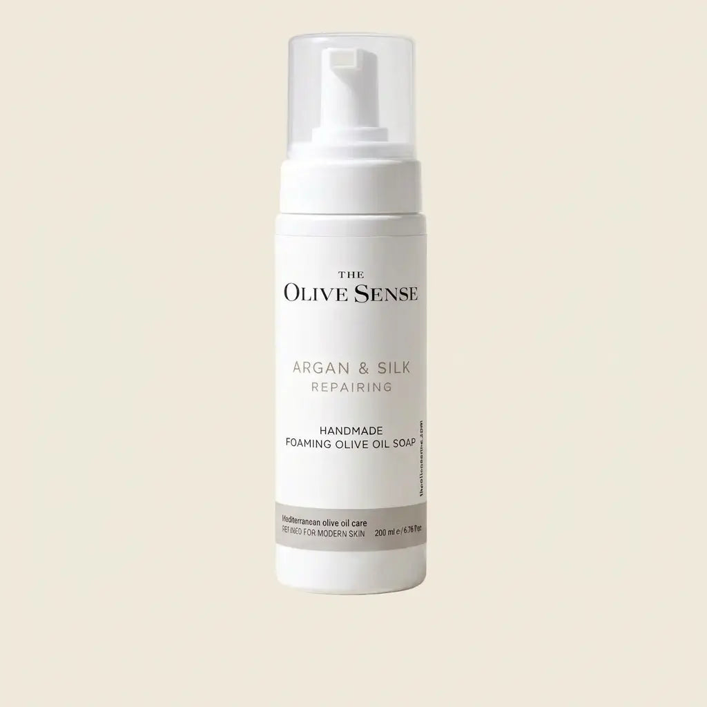 The Olive Sense Argan & Silk Repairing Handmade Foaming Olive Oil Soap in a white pump bottle
