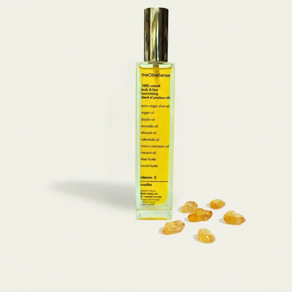 Bottle ofThe Olive Sense body and face oil with vitamin E and fresh mastiha scent.