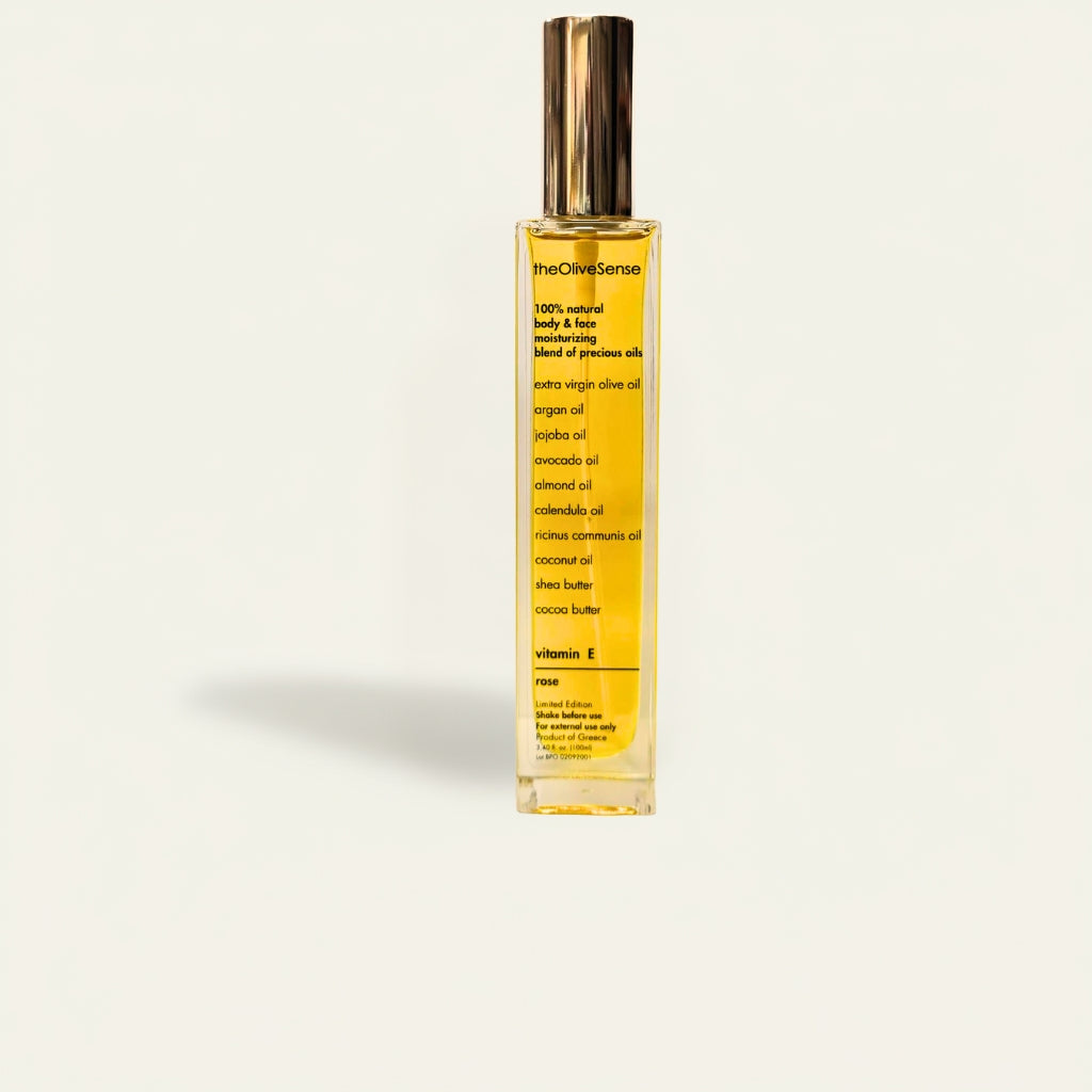 bottle with Body & Face moisturizing blend of precious oils with vitamin E & Rose