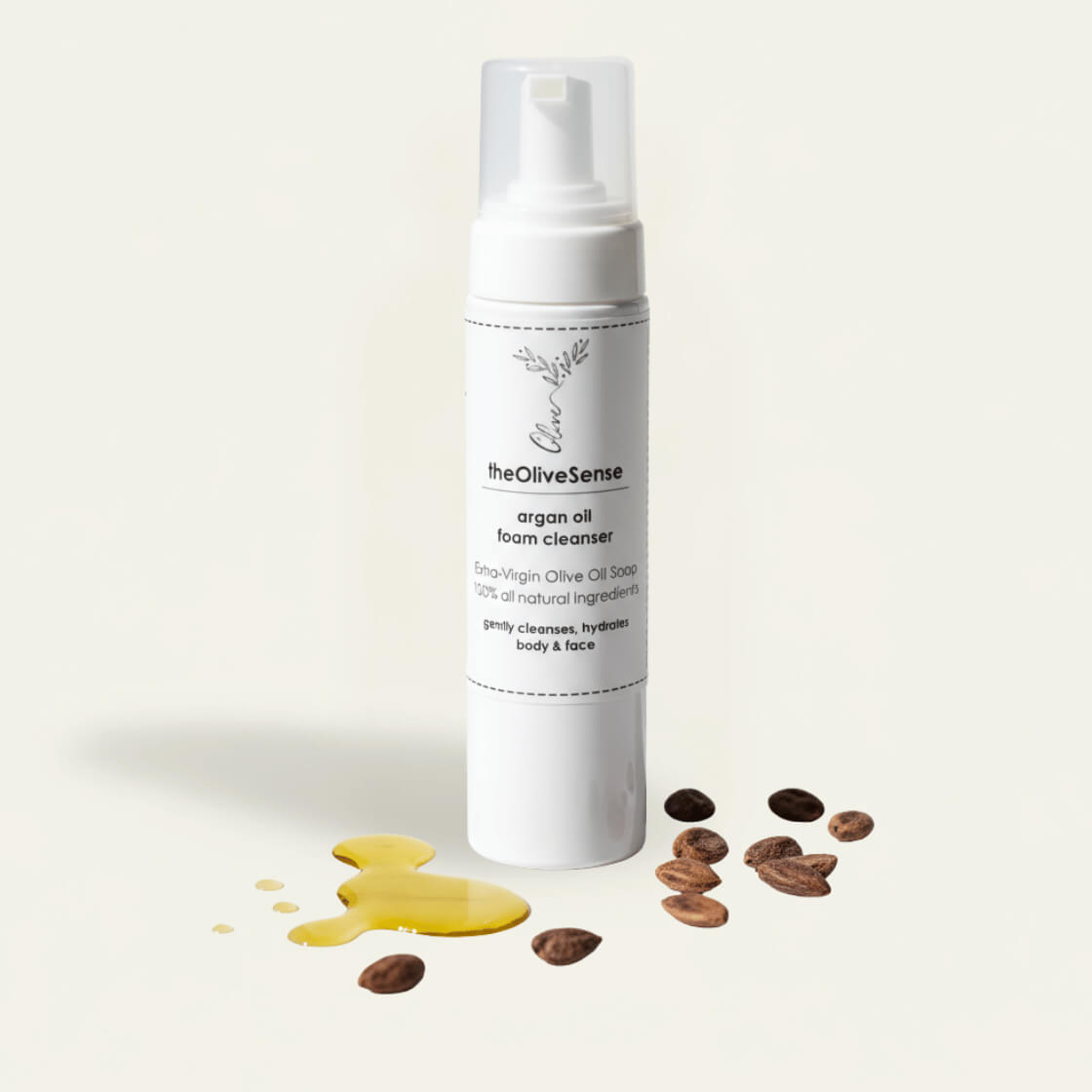 White bottle with a pump dispenser with theOliveSense luxurious handmade cleansing foam combining extra virgin olive oil, Argan oil and silk proteins.