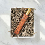 Lip balm in a decorative box on a marble surface