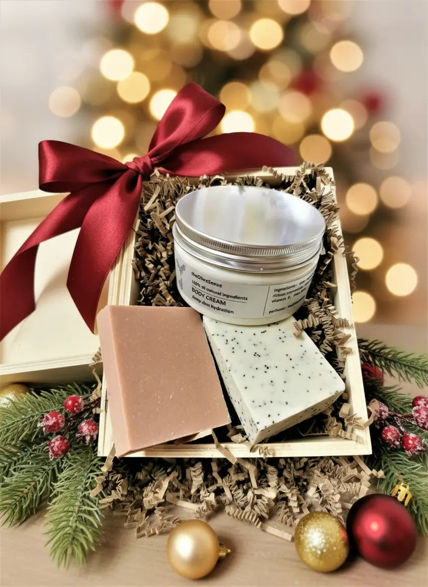 Gift set with body cream, soap, and bath bombs on a wooden tray with a red ribbon against a blurred festive background.
