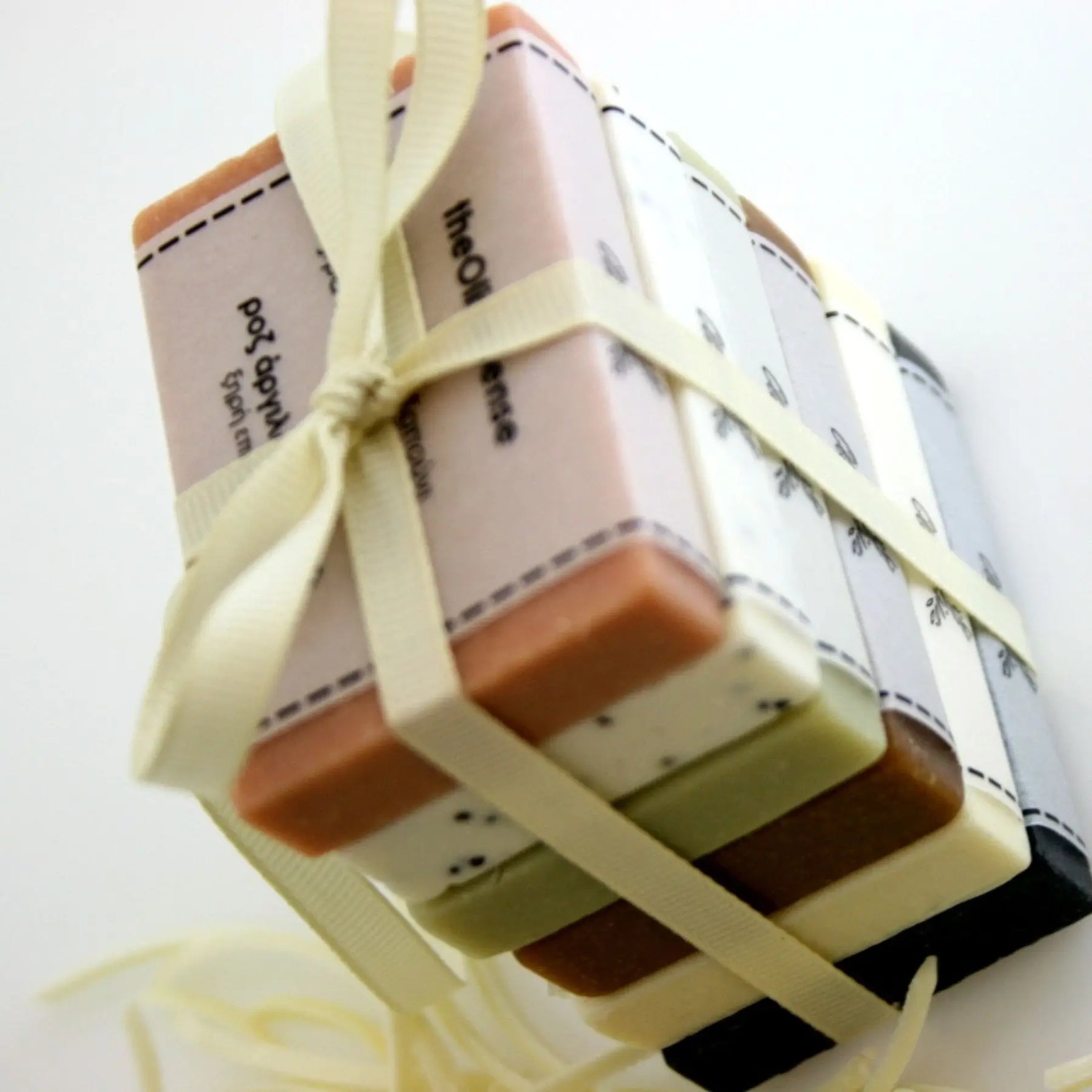 Set of soap bars tied with a ribbon on a white background