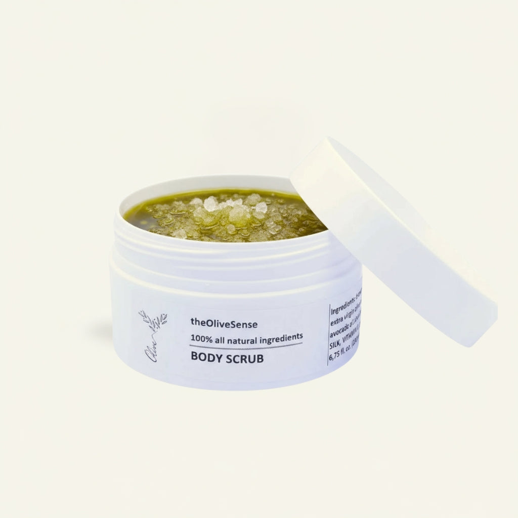 Open jar of body scrub with salt scrub  contents on a white background
